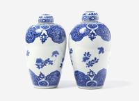 A Similar Pair of Chinese Blue and White Ovoid Jars and Covers