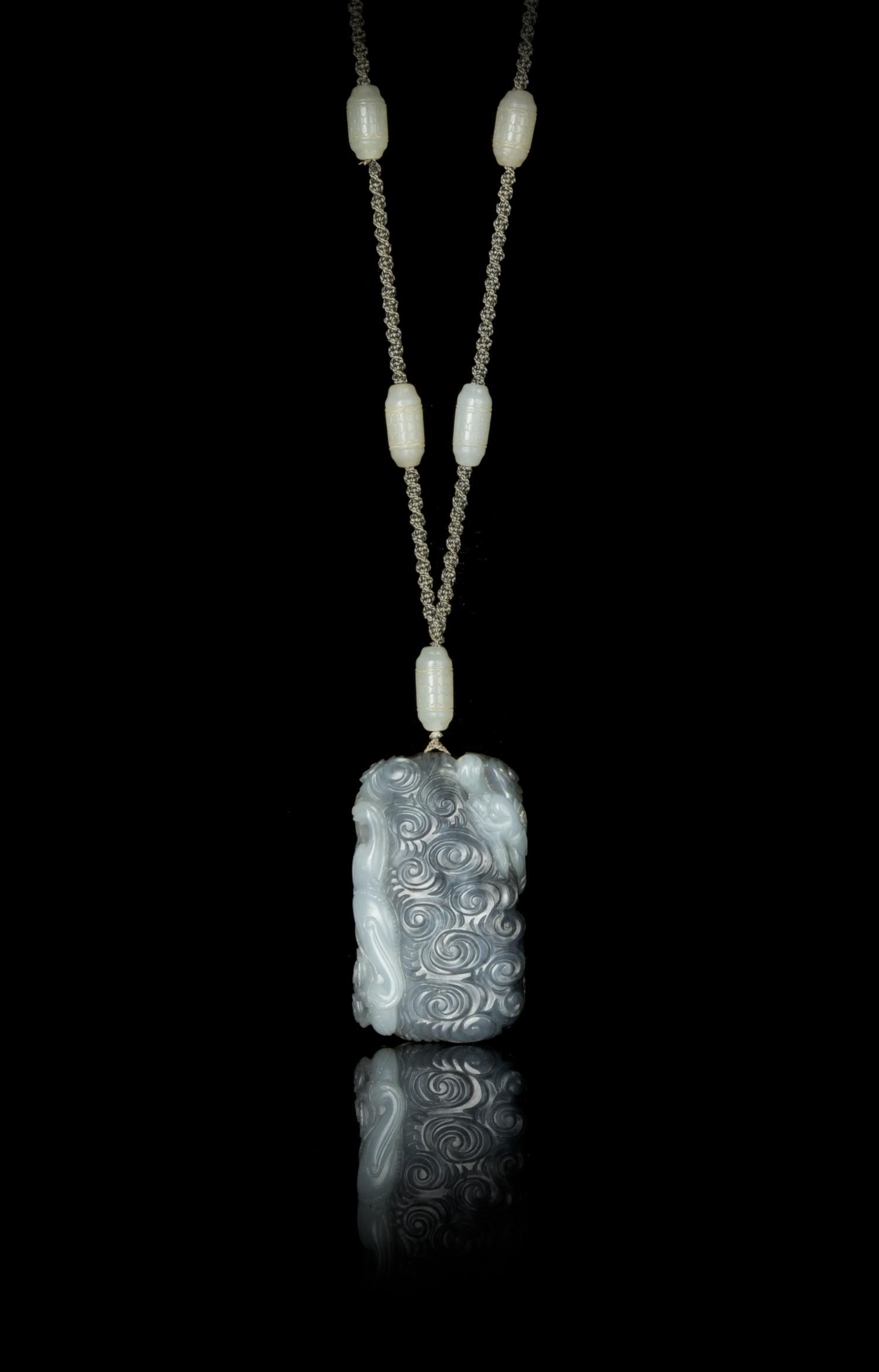 A Grey and White Jade Pendant — 18TH/19TH CENTURY