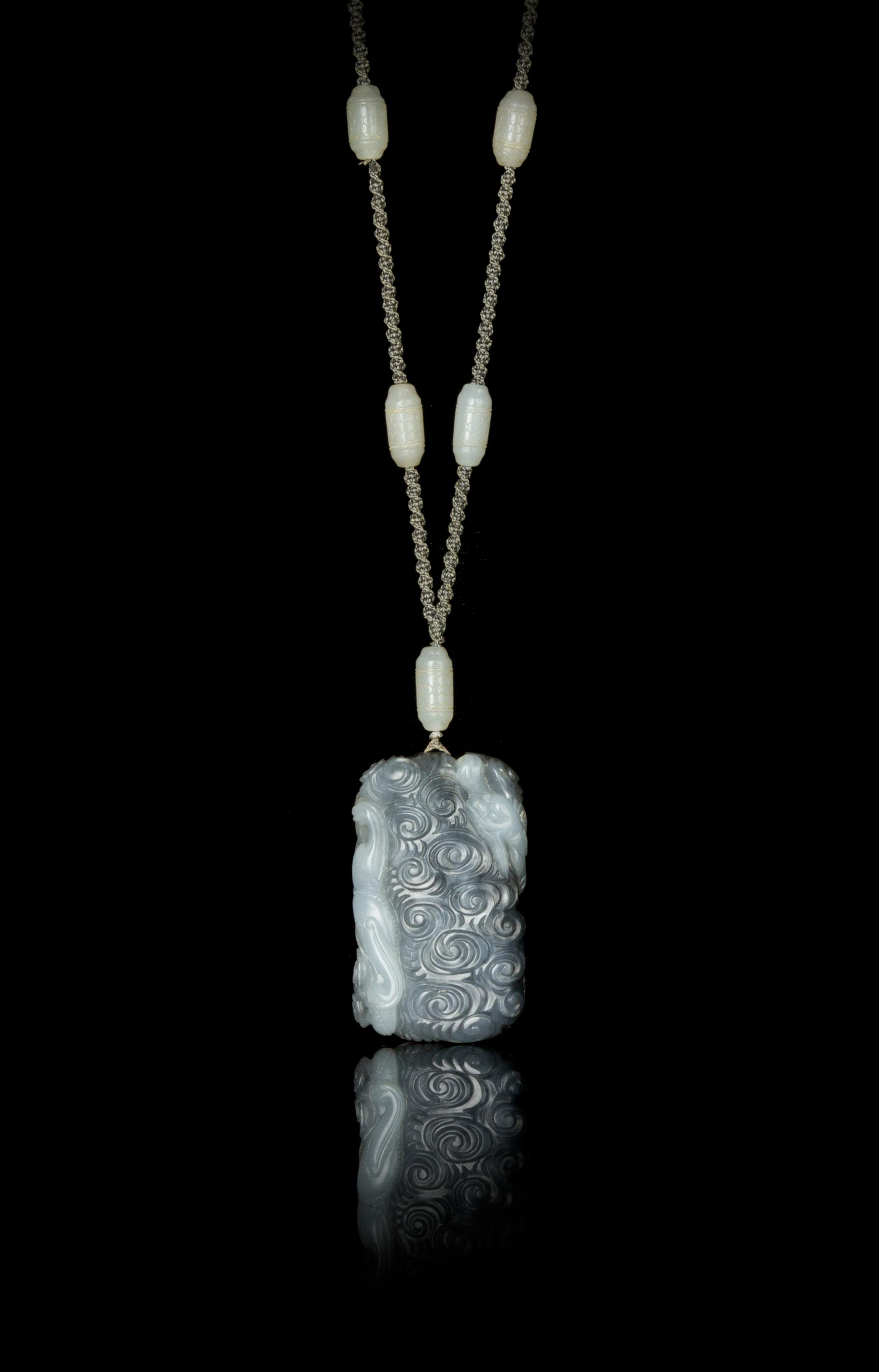 A Grey and White Jade Pendant — 18TH/19TH CENTURY