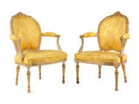 A Matched Pair of George III White-Painted and Parcel-Gilt Armchairs
