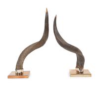 A Pair of Anthony Redmile Impala Horns Mounted on Bronzed Metal Bases