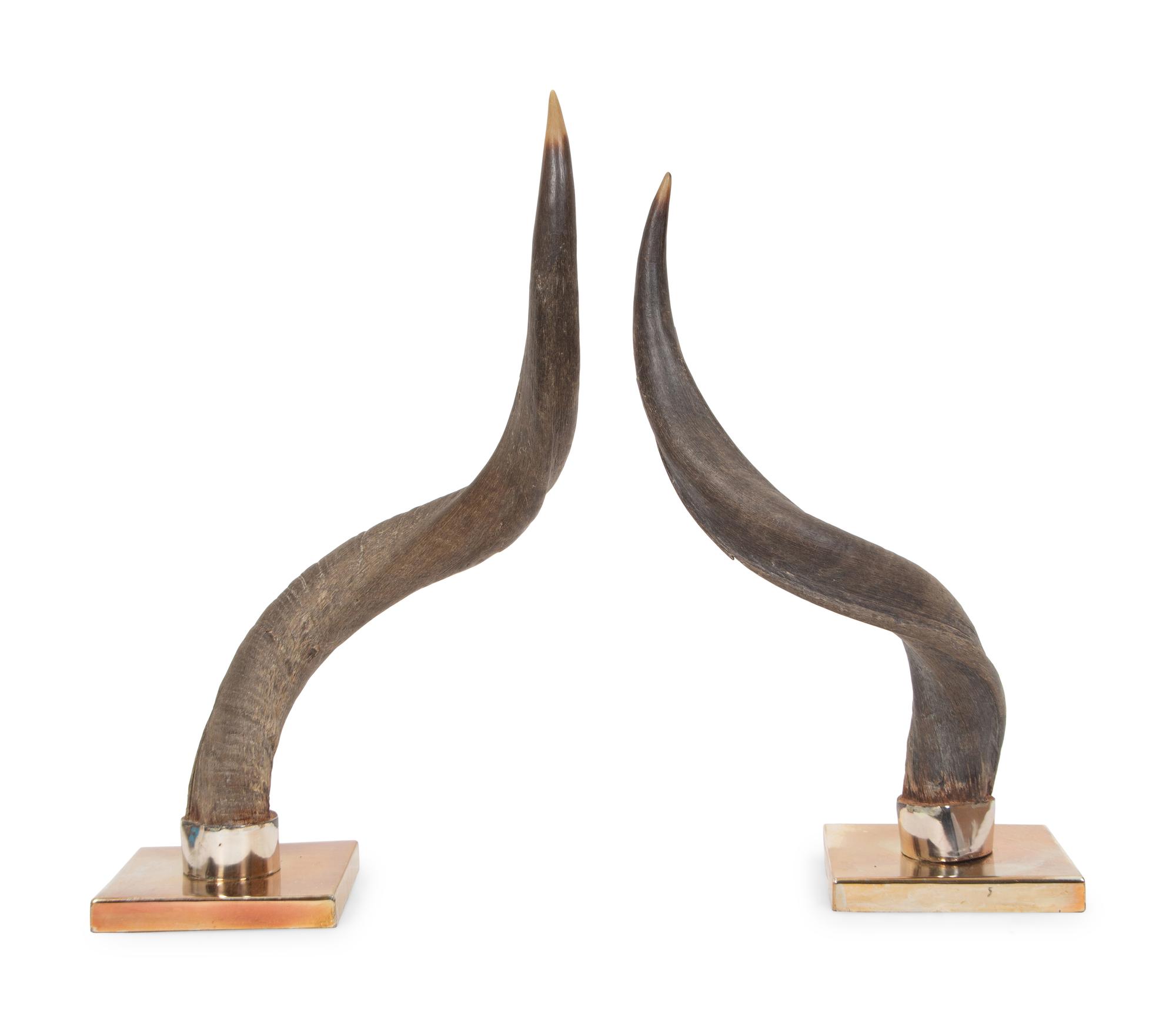 A Pair of Anthony Redmile Impala Horns Mounted on Bronzed Metal Bases