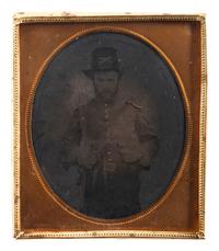 [CIVIL WAR]. Sixth plate tintype of Union cavalryman posed with multiple weapons.
