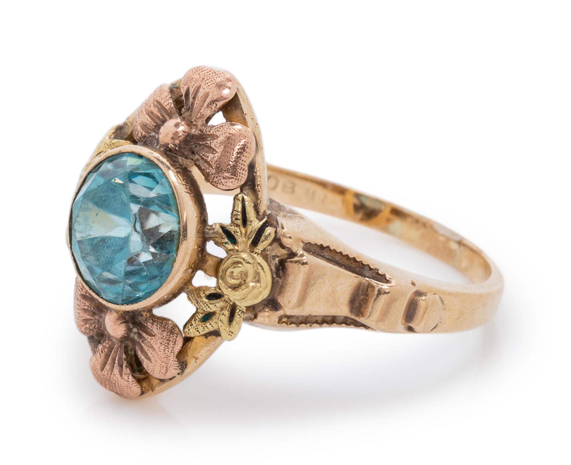 A 10 Karat Bicolor Gold and Blue Zircon Floral Motif Ring,