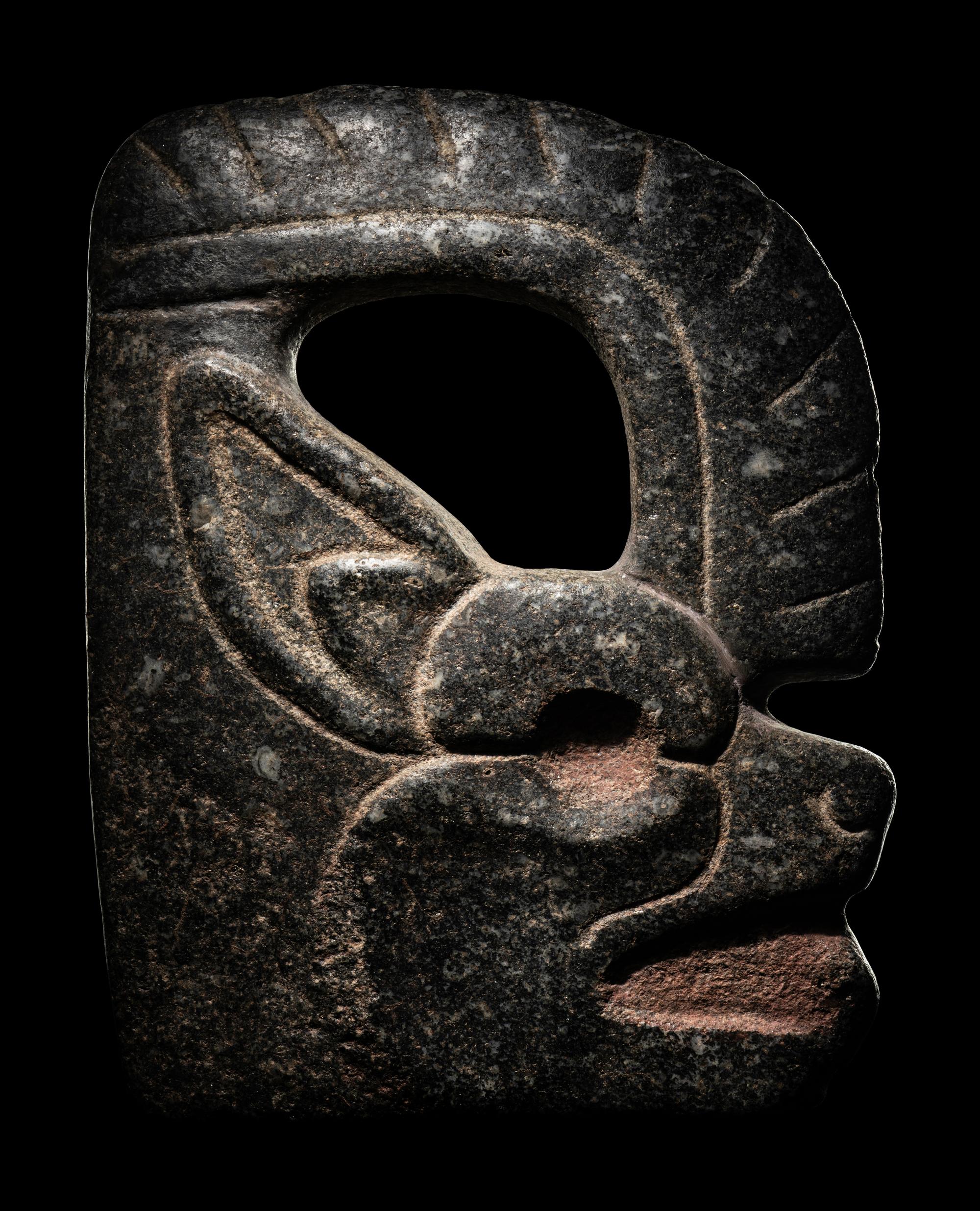 A Maya Stone Hacha in the Form of a Jaguar or Bat