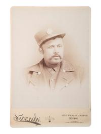[EARLY PHOTOGRAPHY]. HUSZAGH, photographer. Cabinet card of African American firefighter. Chicago, IL, ca late 19th century.