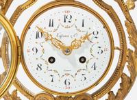 A French Louis XVI style three-piece gilt bronze and white marble clock garniture, retailed by Tiffany & Co., New York, NY, late 19th century