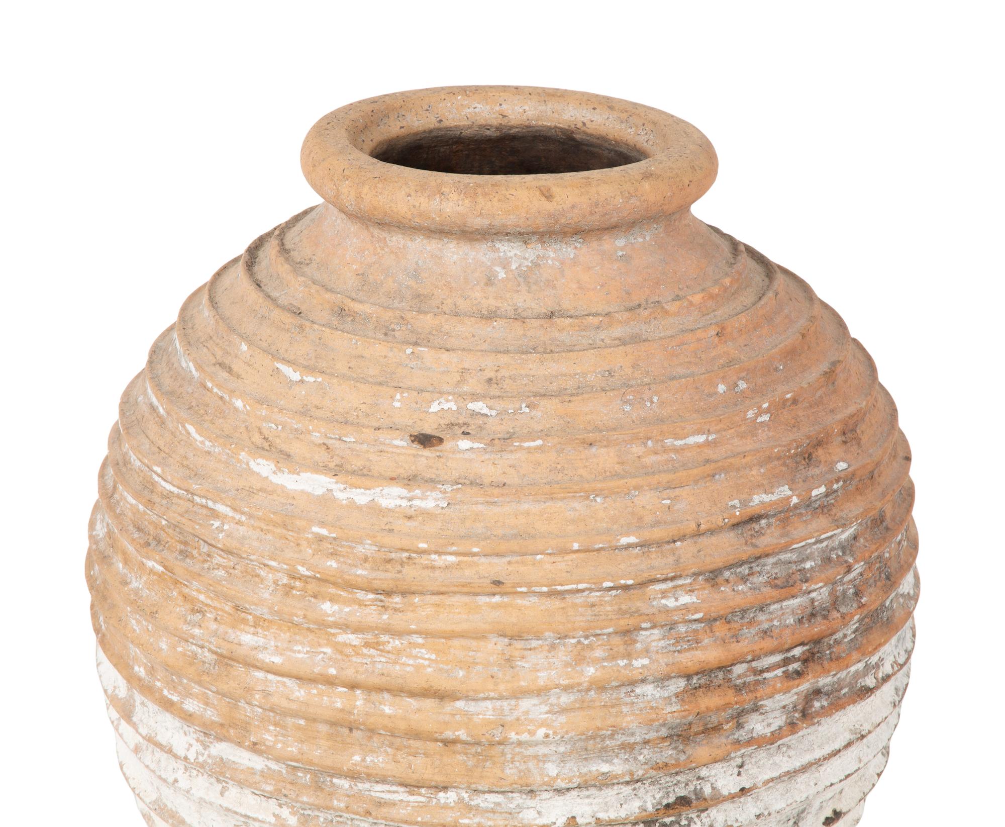 A Large Terra Cotta Jar with Traces of White Pigment — 20TH CENTURY