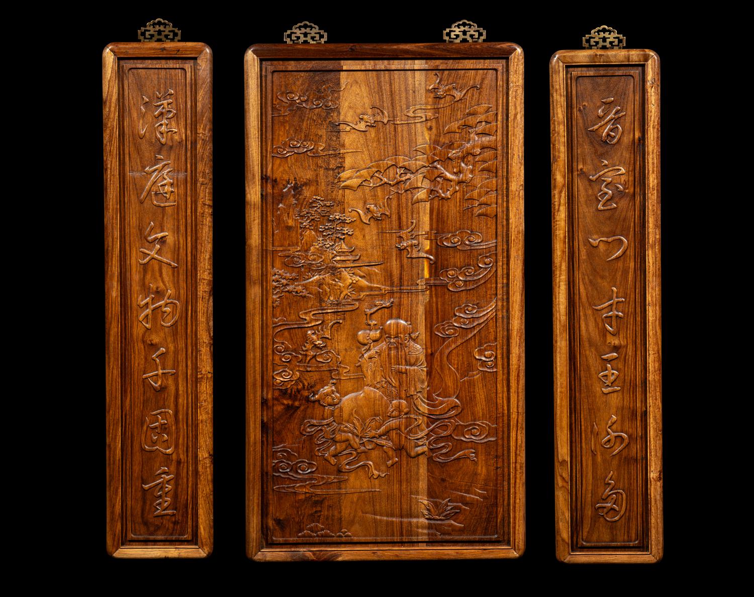 A Set of Three Chinese Huanghuali Couplet Wall Panels