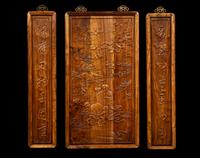 A Set of Three Chinese Huanghuali Couplet Wall Panels
