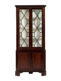 A George III Mahogany Corner Cupboard