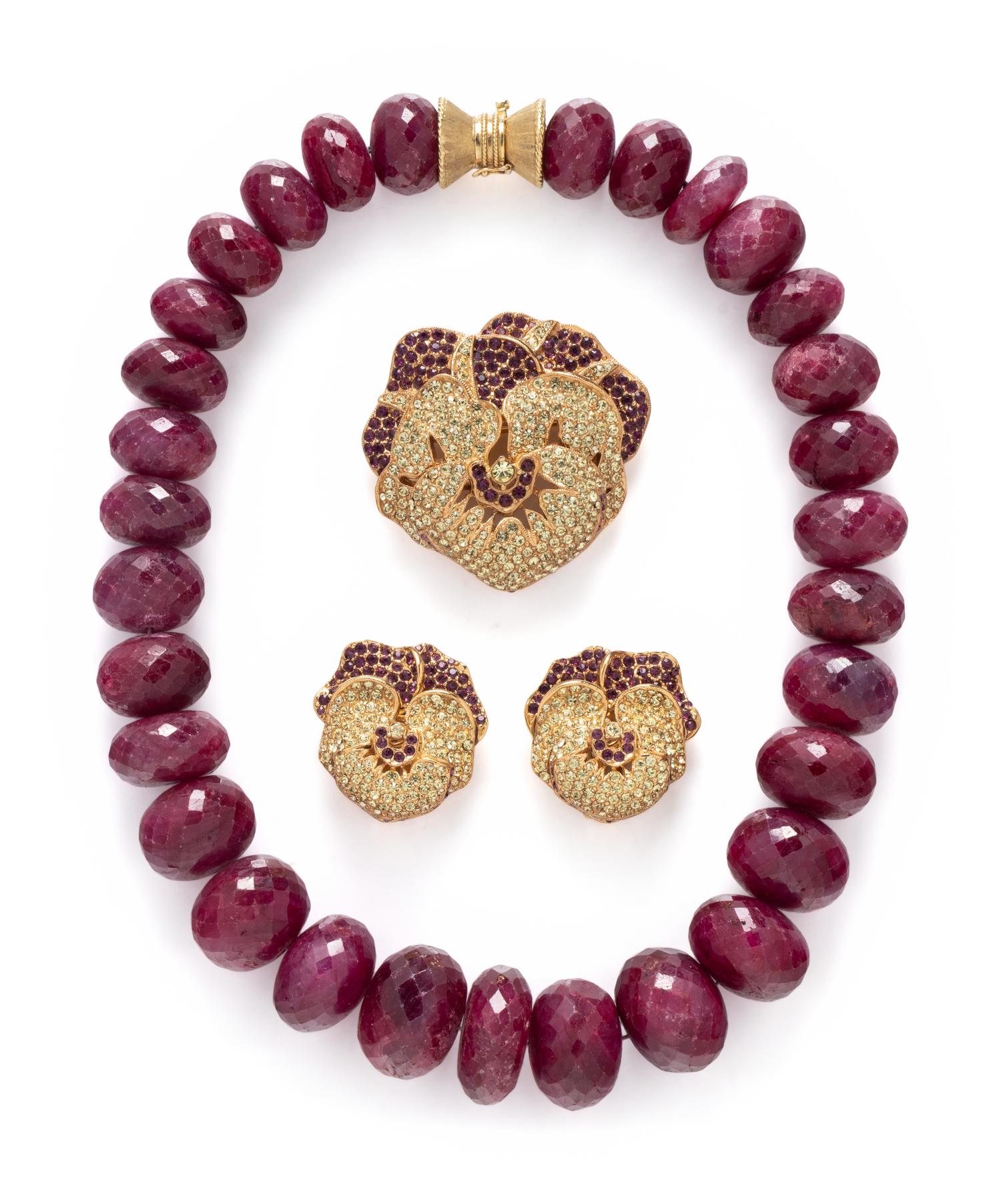 FACETED RUBY BEAD NECKLACE TOGETHER WITH A CINER PANSY DEMI PARURE