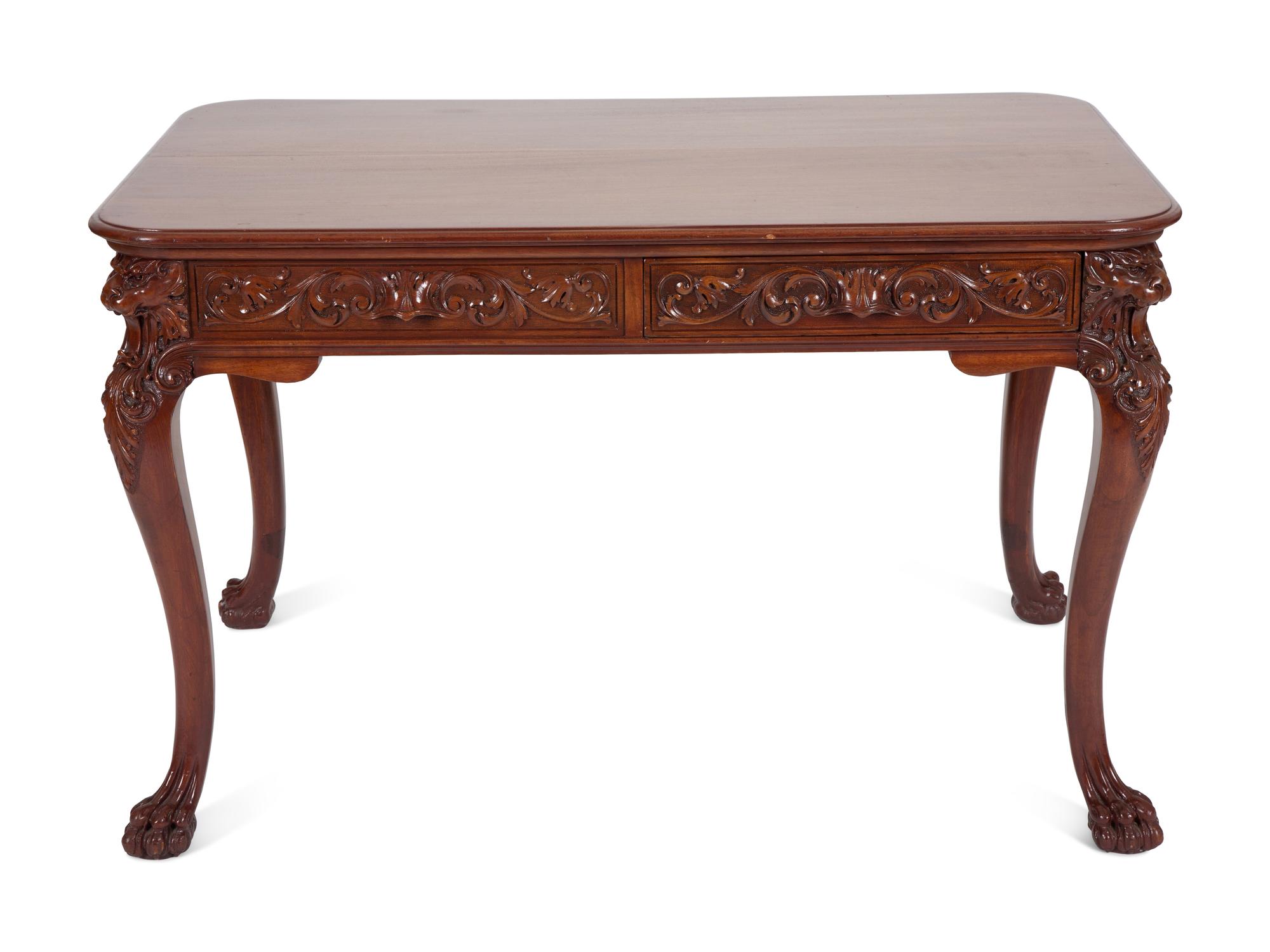 A Georgian Style Carved Mahogany Writing Table