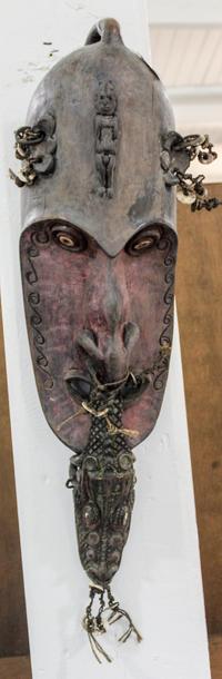 A Carved and Decorated Mask, Papua New Guinea Height 28 inches. — 20TH CENTURY