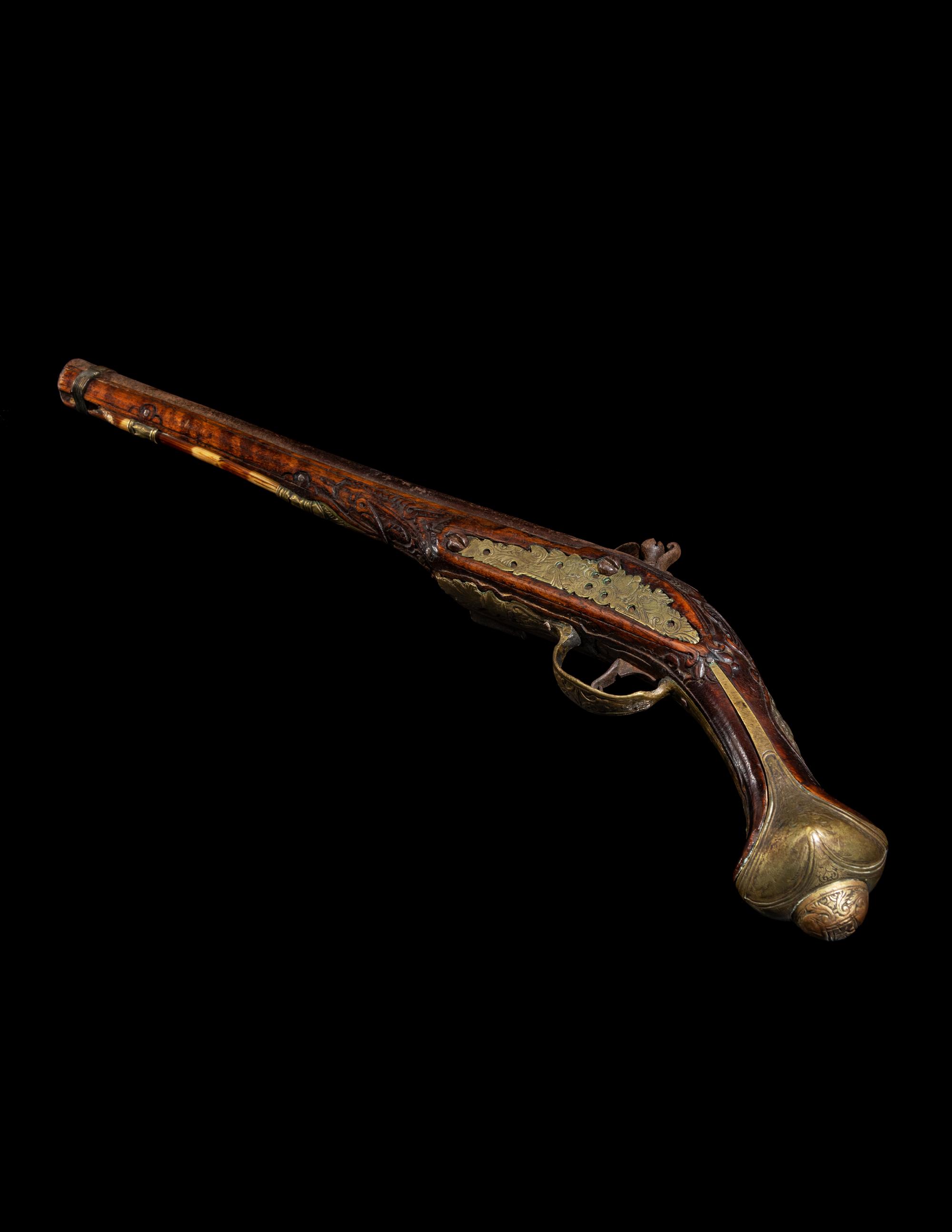 An Engraved Brass-Mounted Flintlock Pistol