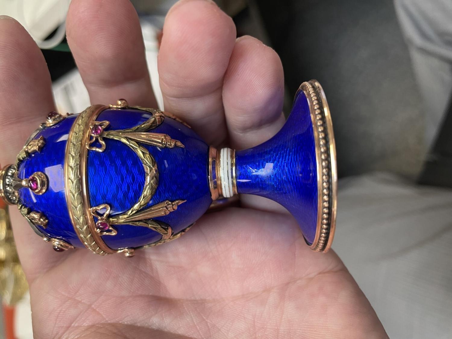 A 14 Karat Vari-Color Gold, Guilloché Enamel, Diamond, and Cabochon Jewel-Mounted Egg-Form Perfume and a Related Guilloché Enamel, 14 Karat Vari-Color Gold, Diamond, and Cabochon-Mounted Surprise Egg