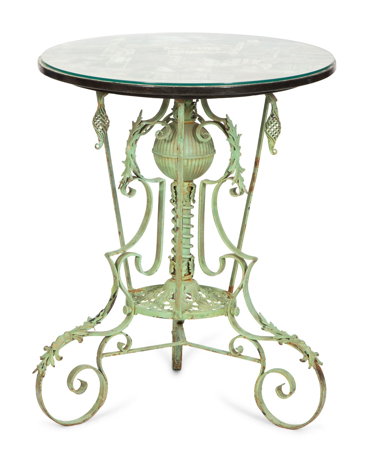A Fornasetti Citta di Carte Table Top on Painted Wrought Iron Base