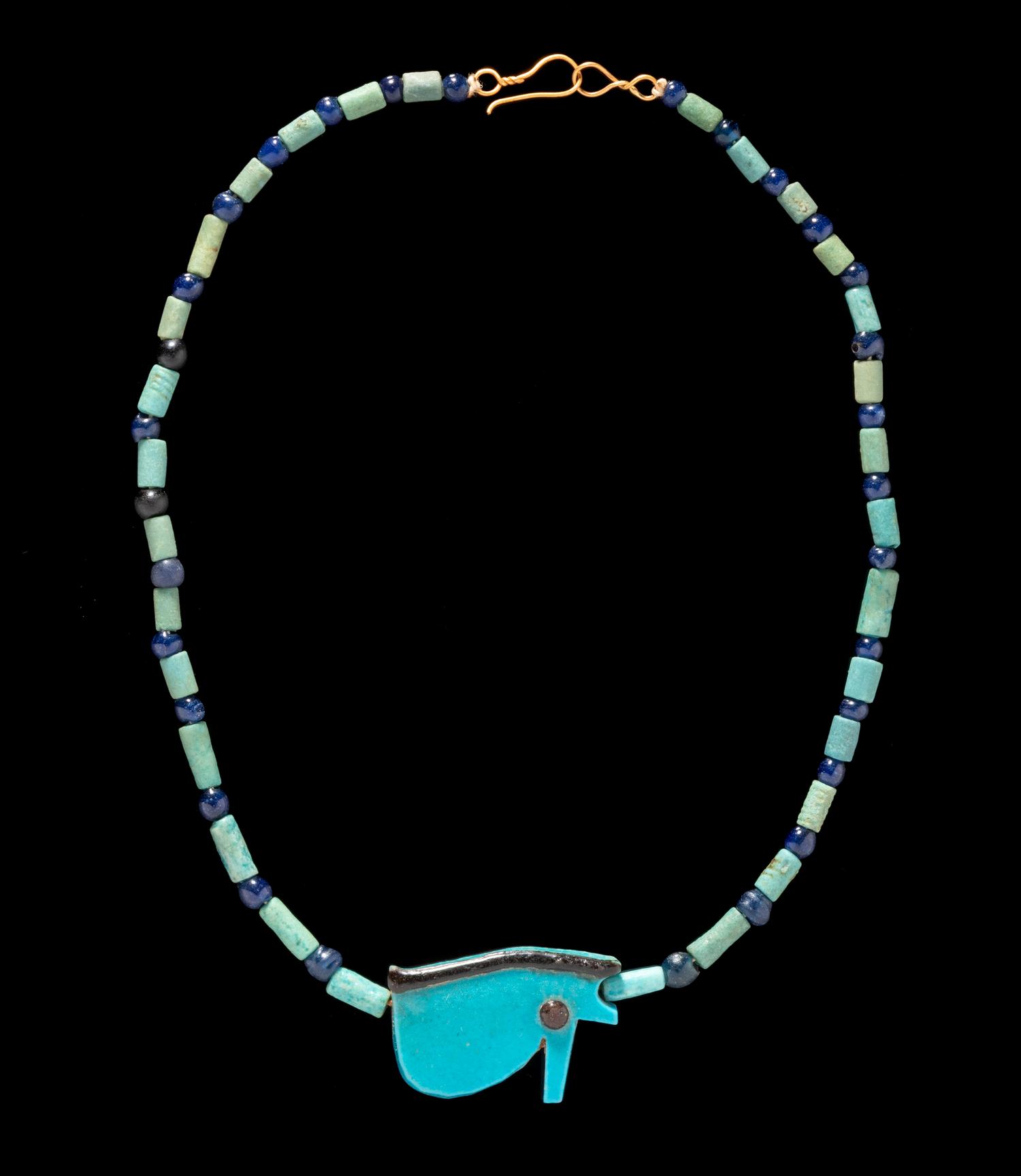 An Egyptian Faience and Blue Glass Bead Necklace