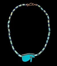 An Egyptian Faience and Blue Glass Bead Necklace