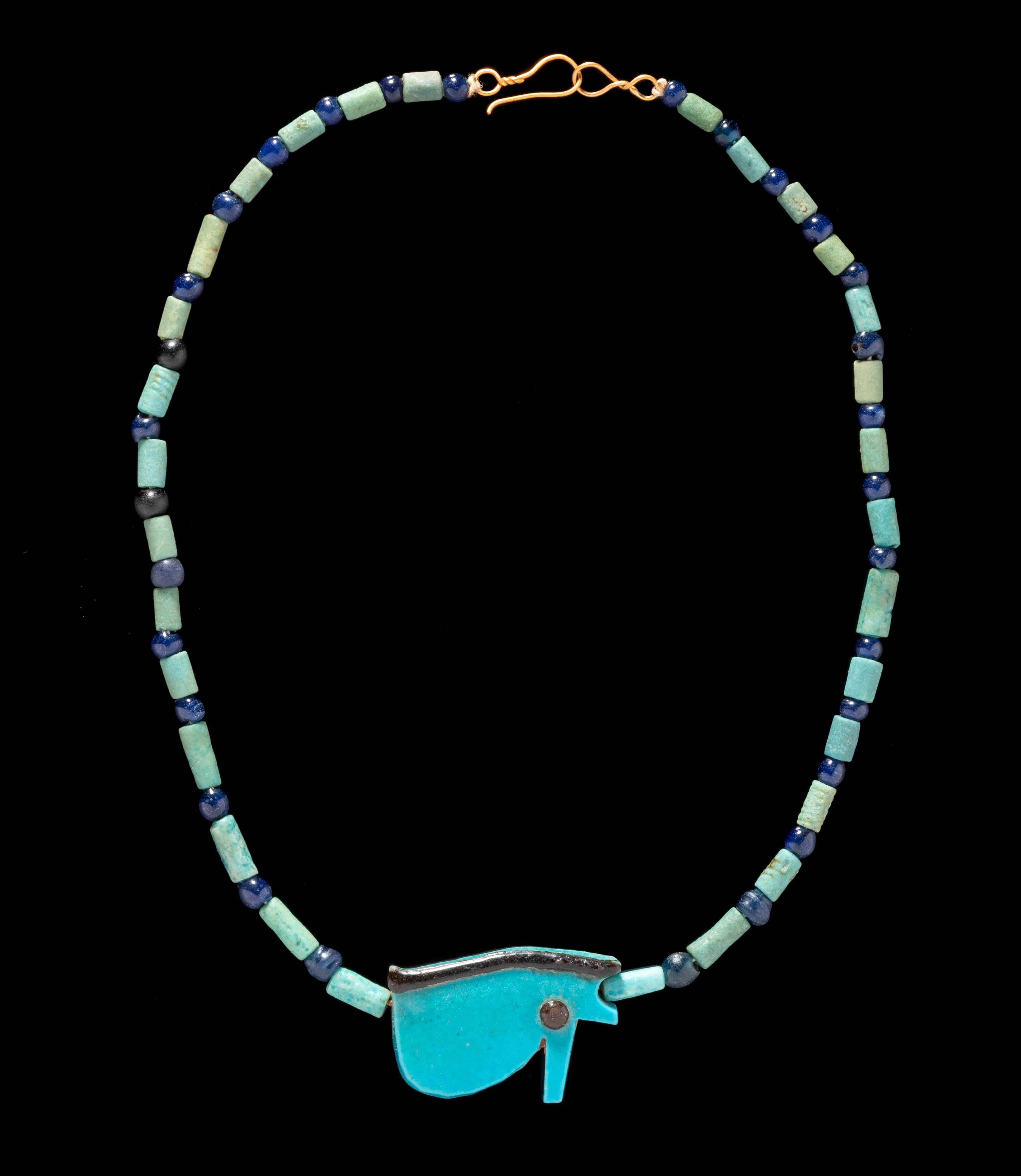 An Egyptian Faience and Blue Glass Bead Necklace