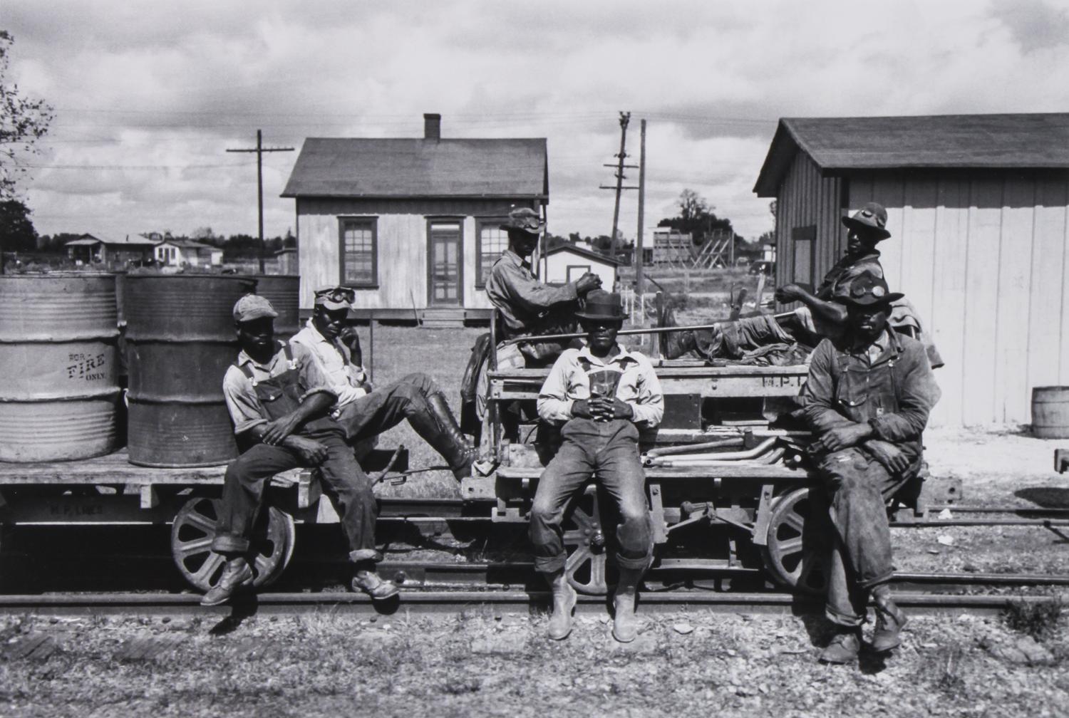 A Group of Four Reproduction Historical Photographs Largest 10 3/4 x 13 3/4 inches.