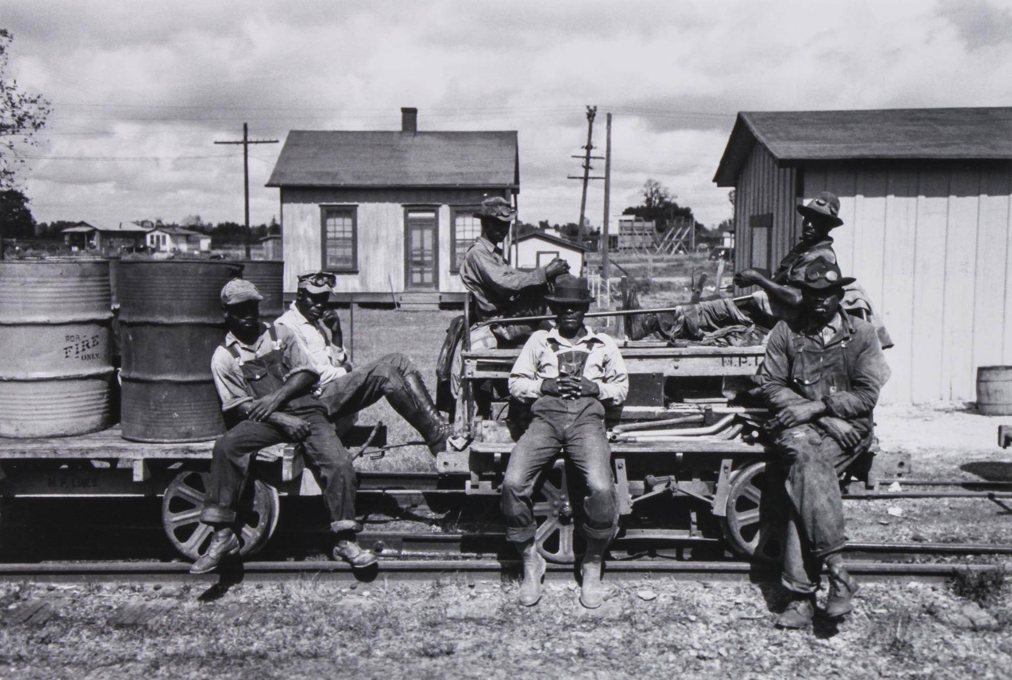 A Group of Four Reproduction Historical Photographs Largest 10 3/4 x 13 3/4 inches.