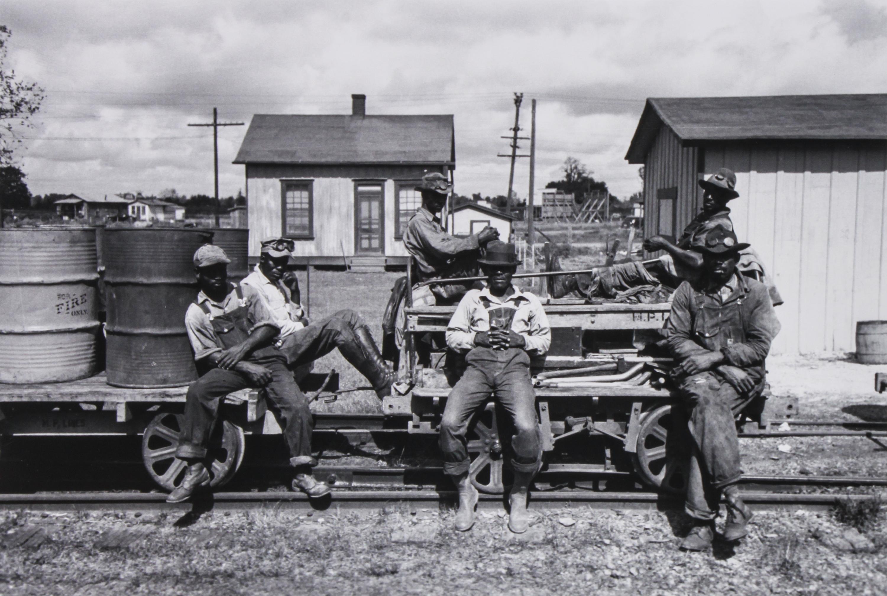 A Group of Four Reproduction Historical Photographs Largest 10 3/4 x 13 3/4 inches.