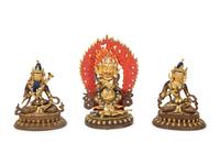 A Group of Three Tibetan Polychromed Brass Deities