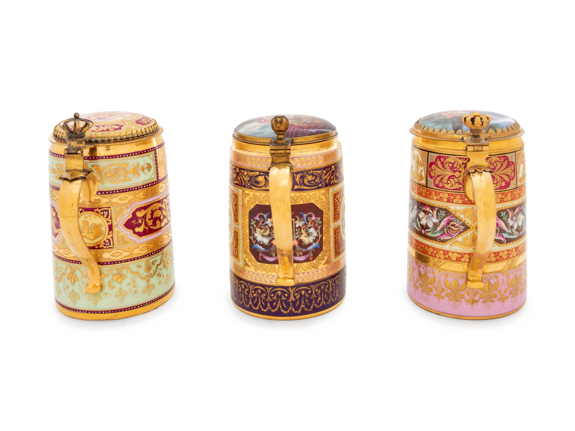 Three Vienna Painted and Parcel Gilt Porcelain Tankards