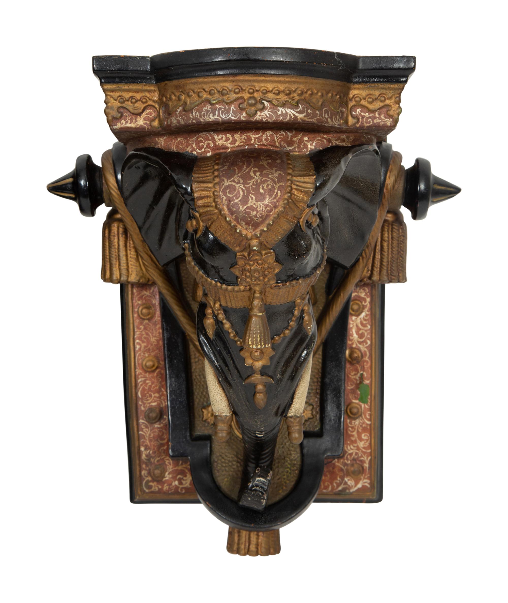A Pair of Painted and Parcel Gilt Earthenware Elephant-Form Wall Brackets
