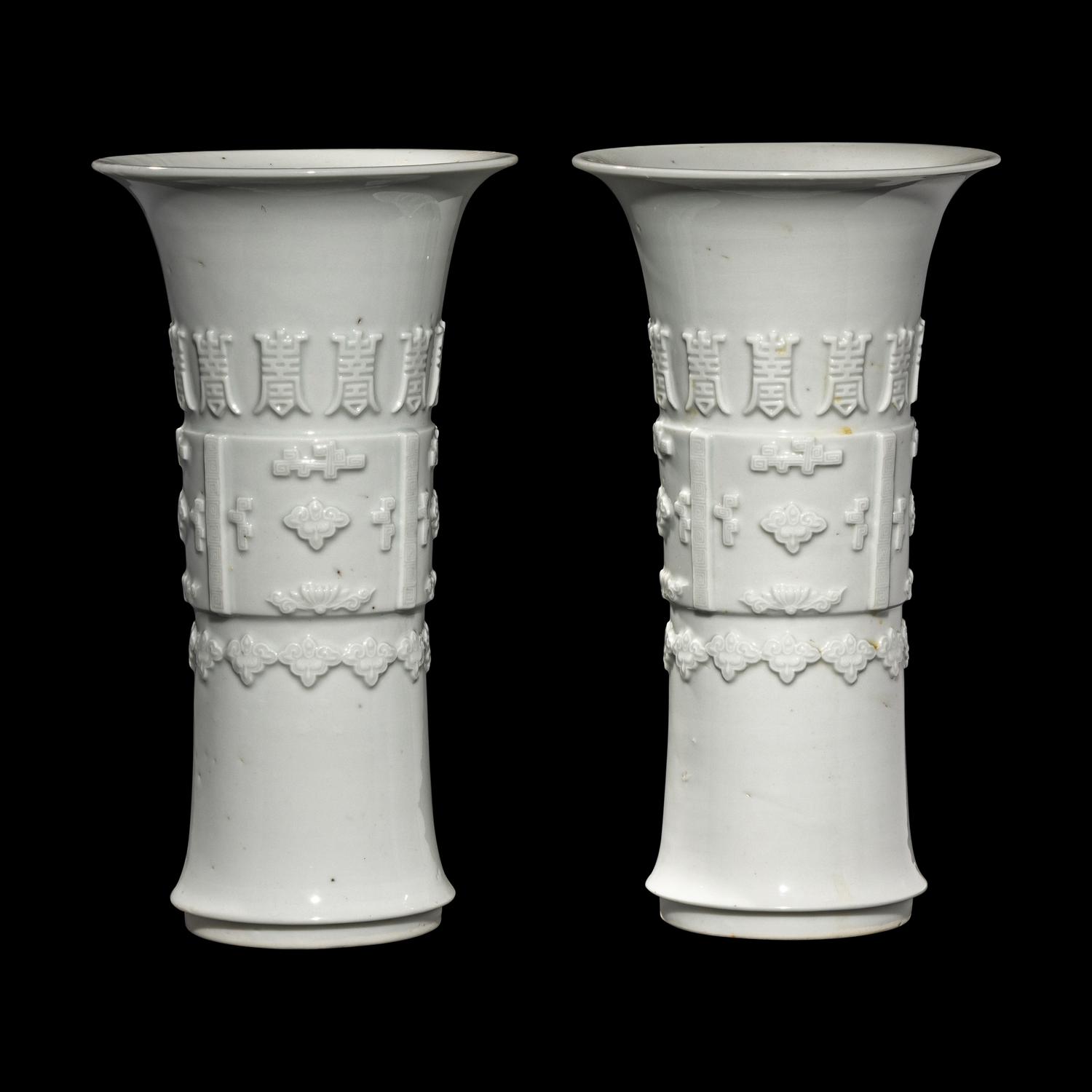 A Pair of Chinese Blanc-de-Chine Porcelain Gu Vases, Qing Dynasty 清 德化白瓷貼塑萬壽 如意花觚 一對