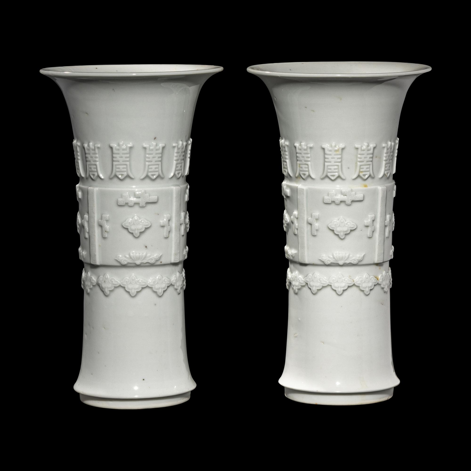 A Pair of Chinese Blanc-de-Chine Porcelain Gu Vases, Qing Dynasty 清 德化白瓷貼塑萬壽 如意花觚 一對