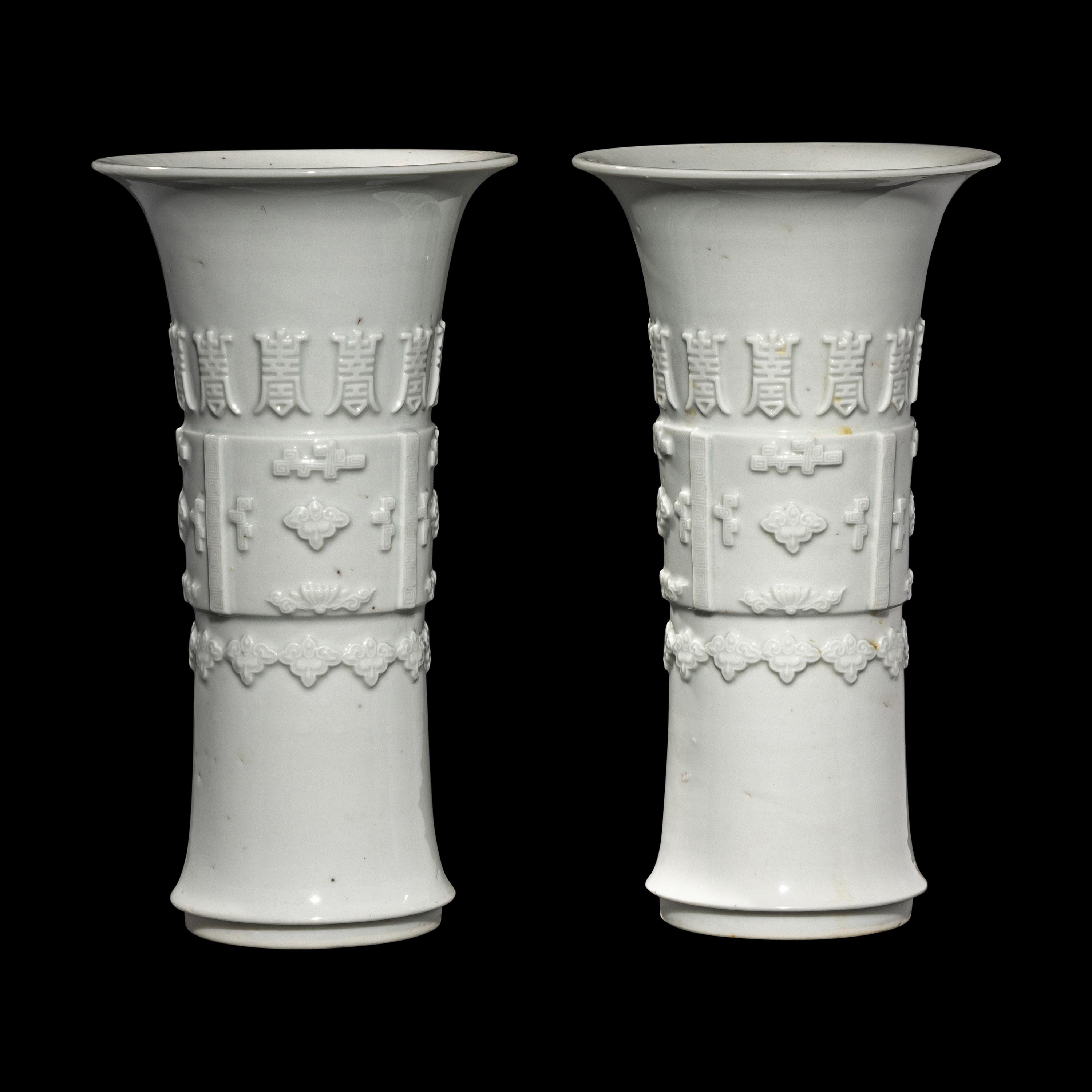 A Pair of Chinese Blanc-de-Chine Porcelain Gu Vases, Qing Dynasty 清 德化白瓷貼塑萬壽 如意花觚 一對