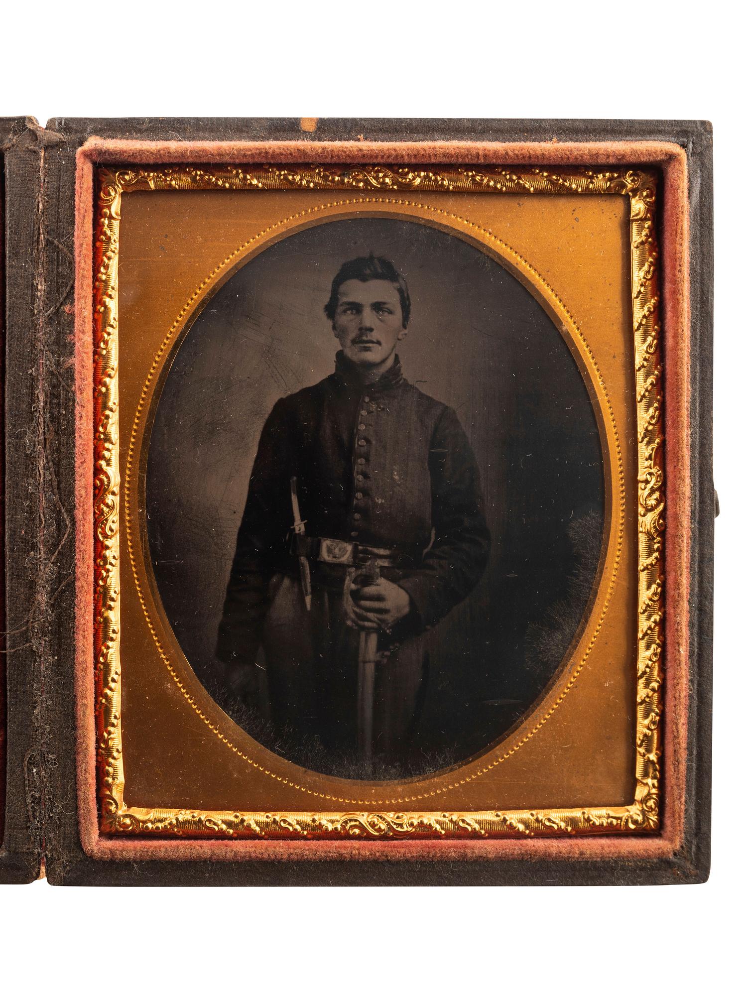 [CIVIL WAR]. Sixth plate tintype of a Union Cavalry private with sword and Bowie knife.