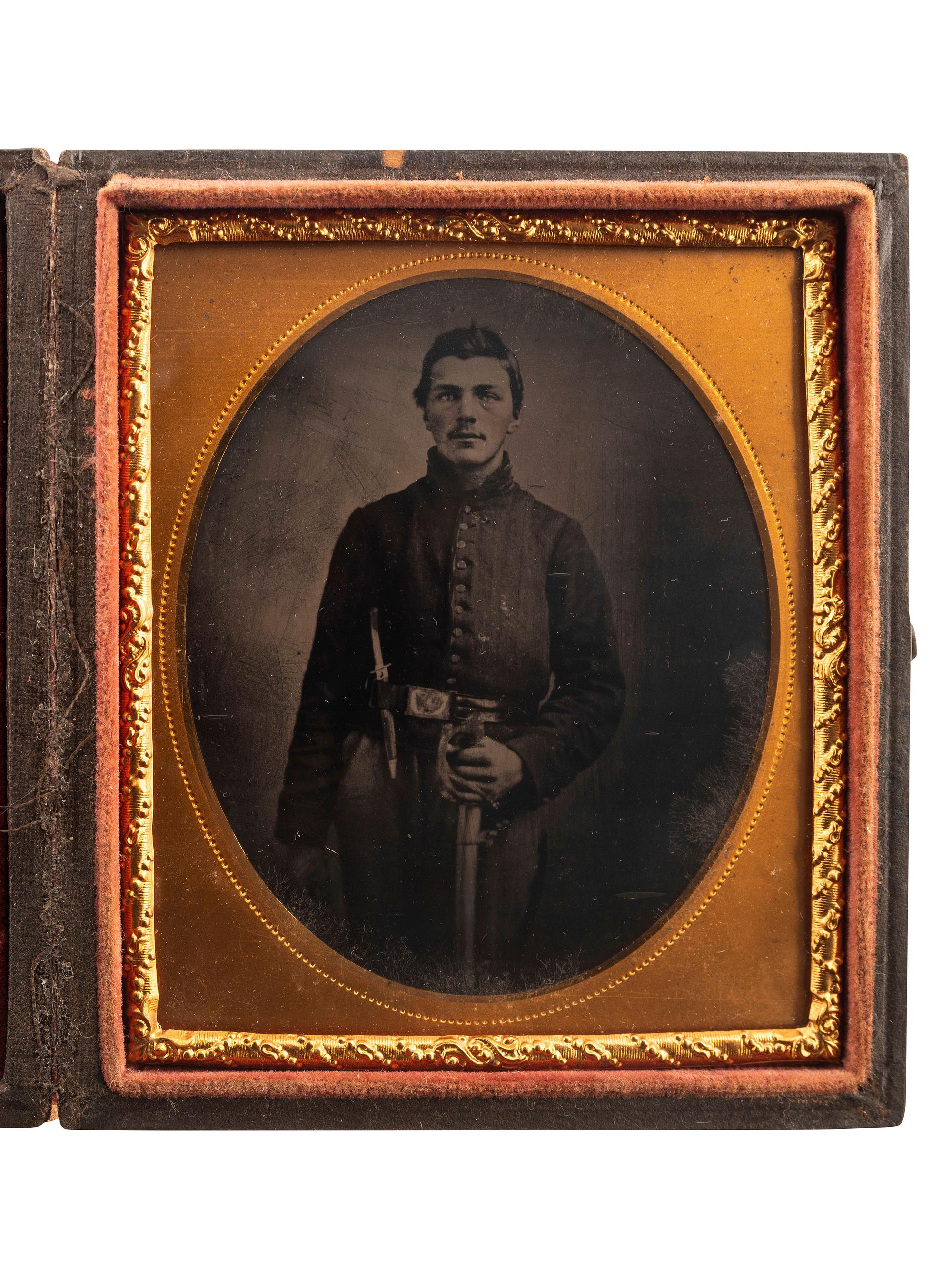 [CIVIL WAR]. Sixth plate tintype of a Union Cavalry private with sword and Bowie knife.