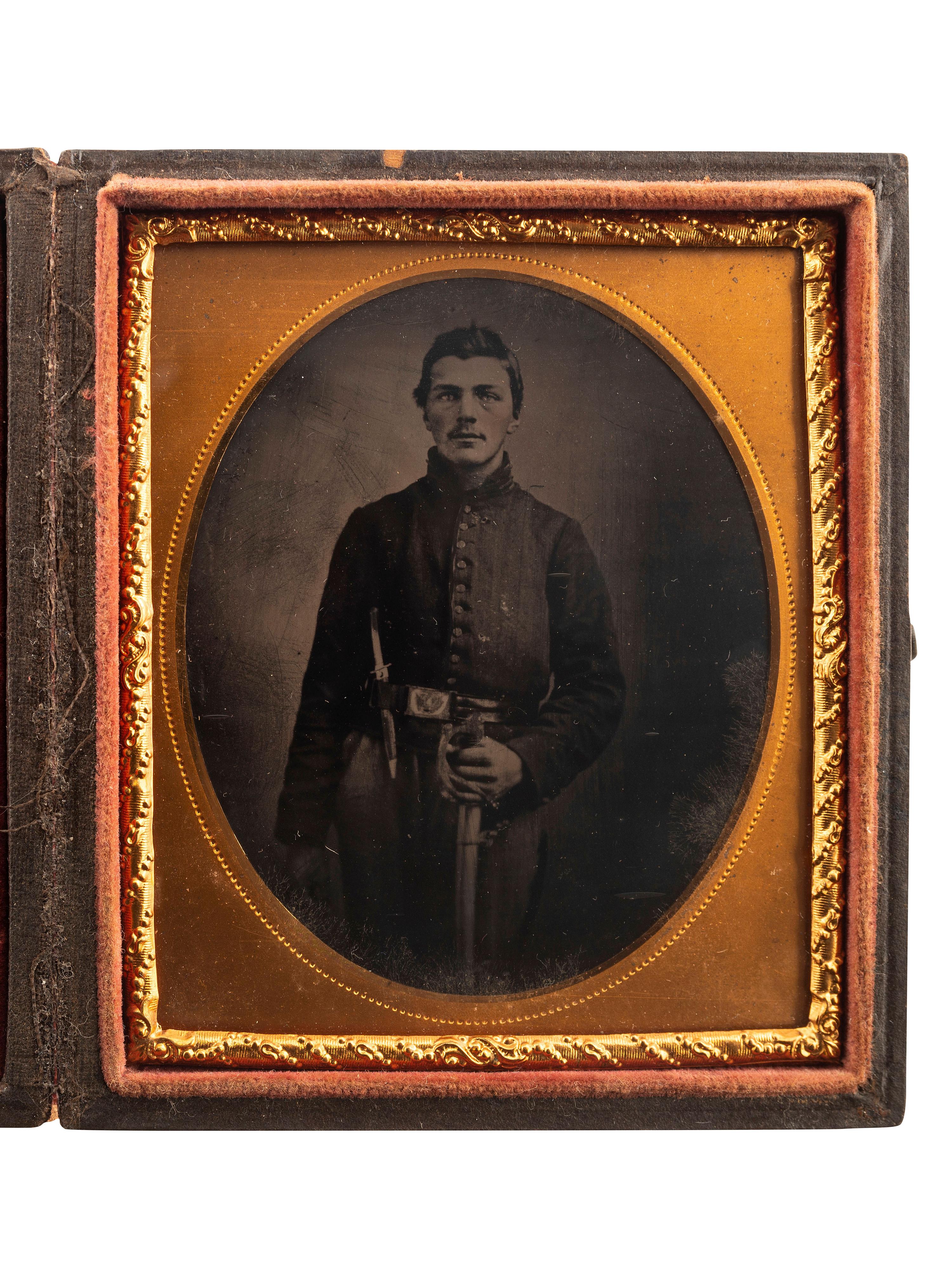 [CIVIL WAR]. Sixth plate tintype of a Union Cavalry private with sword and Bowie knife.