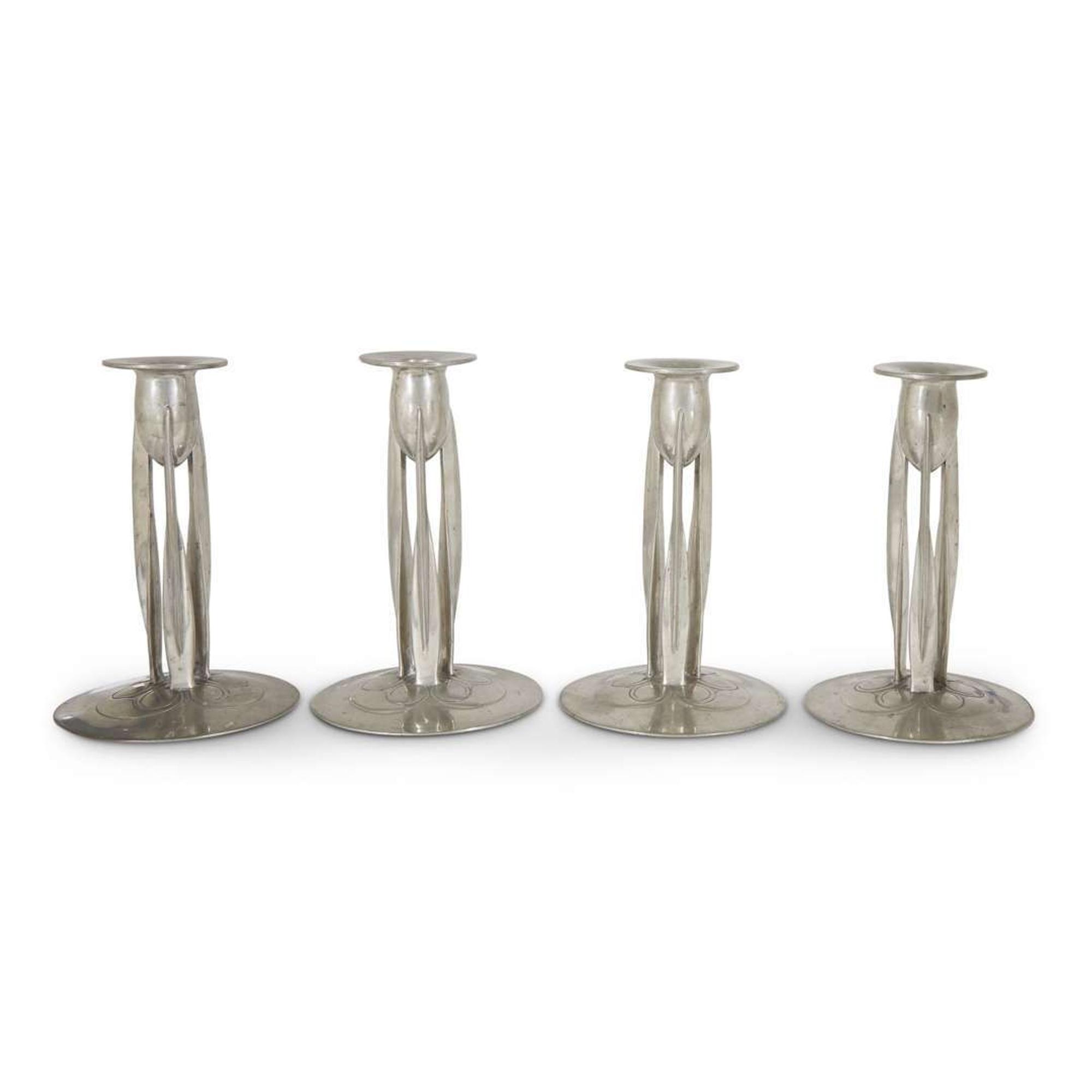 Archibald Knox for Liberty & Co. assembled set of four pewter "tudric" candlesticks, england,circa 1905