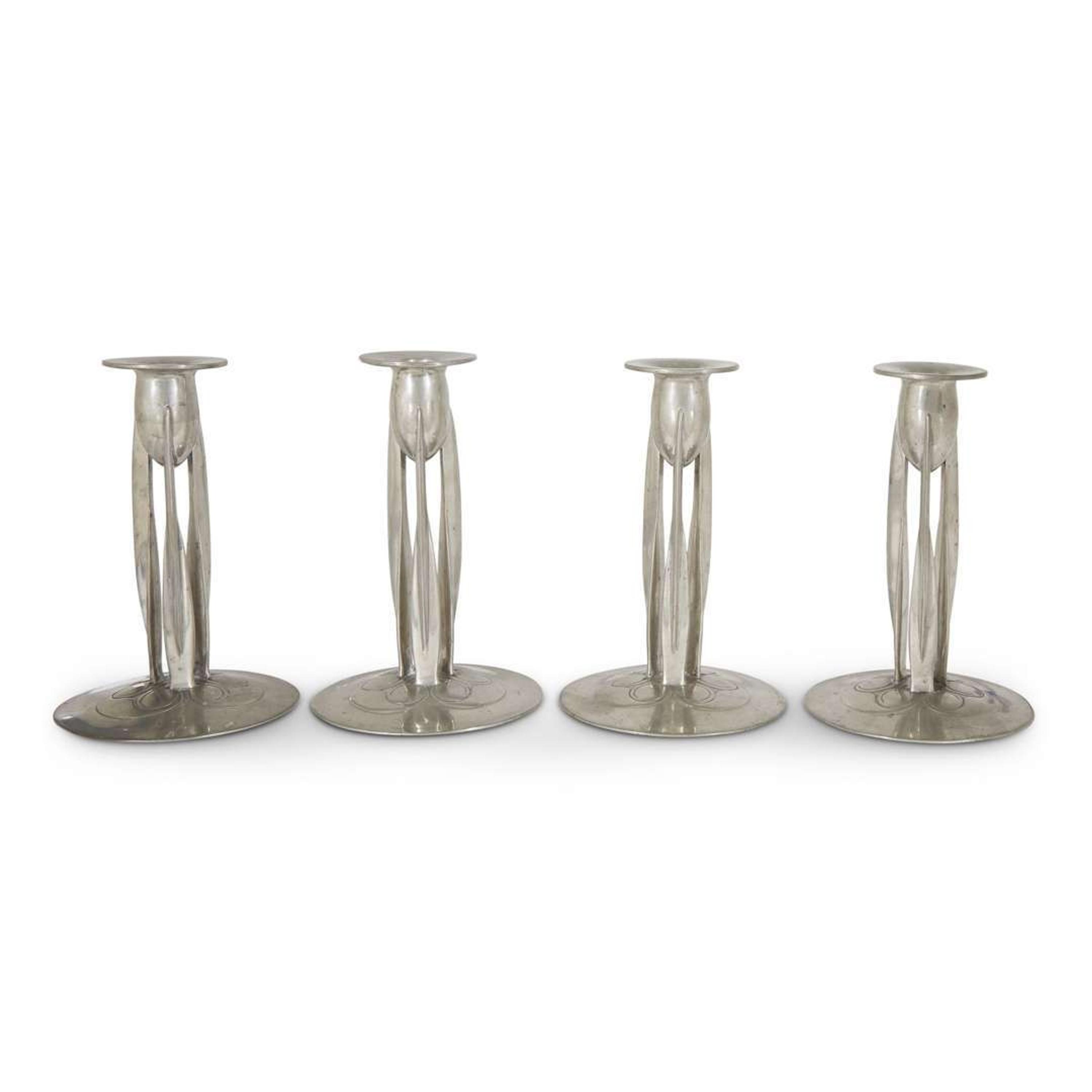 Archibald Knox for Liberty & Co. assembled set of four pewter "tudric" candlesticks, england,circa 1905