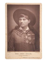 [WILD WEST SHOWS]. Miss Annie Oakley, "Little Miss Sure-Shot," Buffalo Bill's Wild West. Woodburytype cabinet card. [England: ca 1890s].