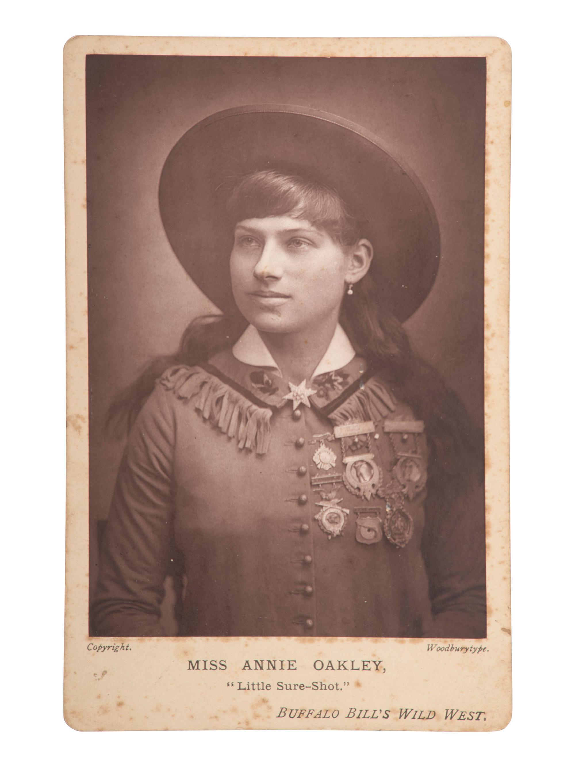 [WILD WEST SHOWS]. Miss Annie Oakley, "Little Miss Sure-Shot," Buffalo Bill's Wild West. Woodburytype cabinet card. [England: ca 1890s].