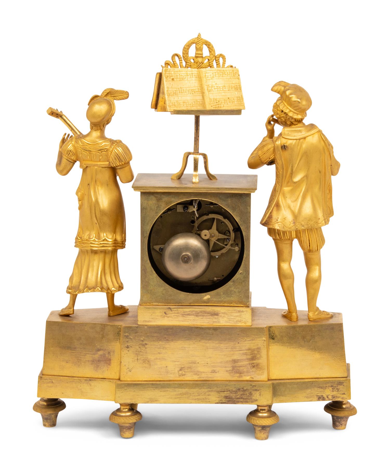 An Empire Gilt Bronze Figural Mantel Clock