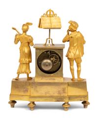 An Empire Gilt Bronze Figural Mantel Clock