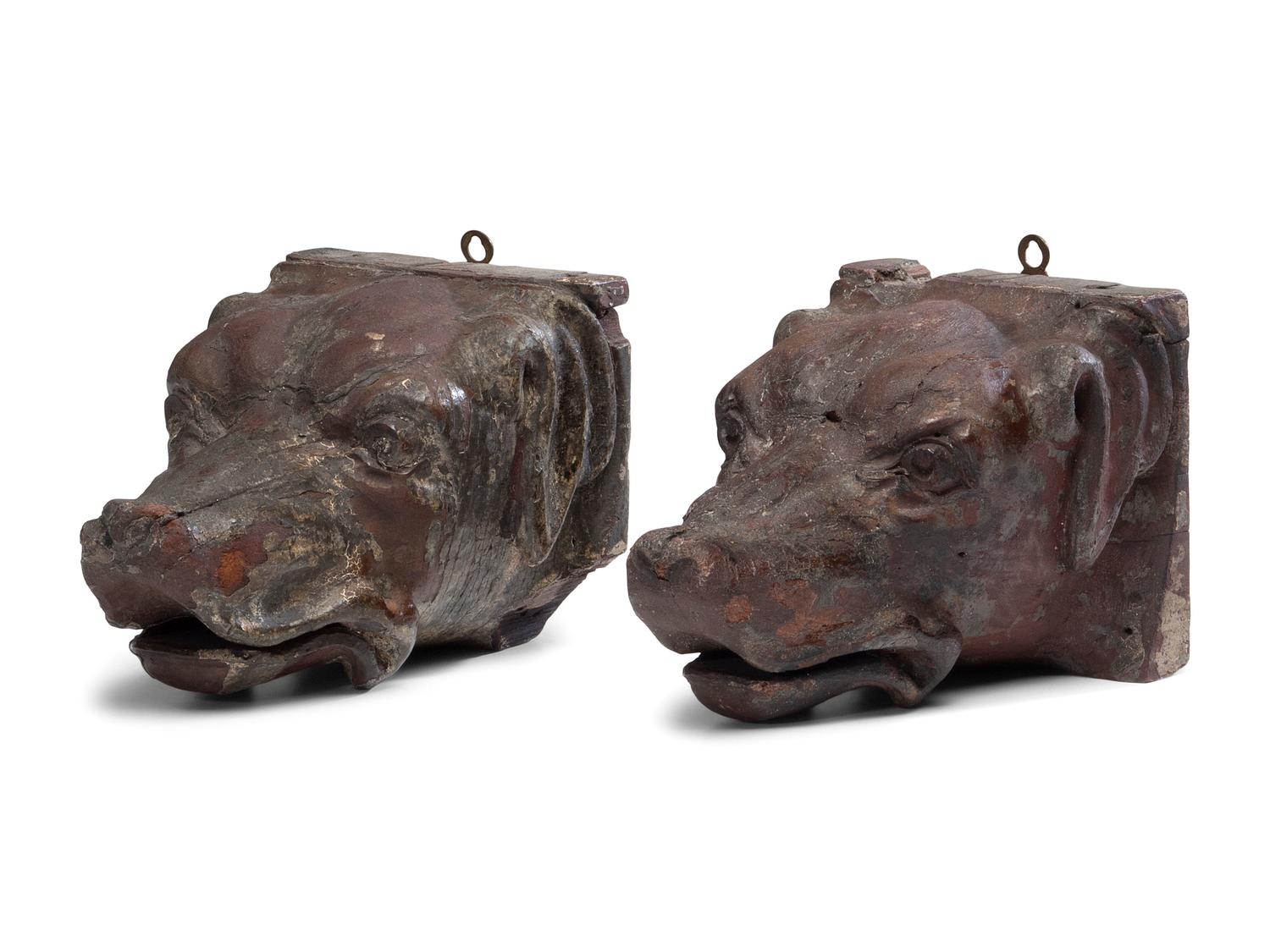 A Pair of Carved Walnut Dog-Form Wall Mounts