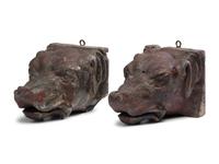 A Pair of Carved Walnut Dog-Form Wall Mounts