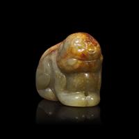 A Small Chinese Brown and Celadon Jade Mythical Beast, Ming Dynasty or Earlier 明或更早 青玉瑞獸