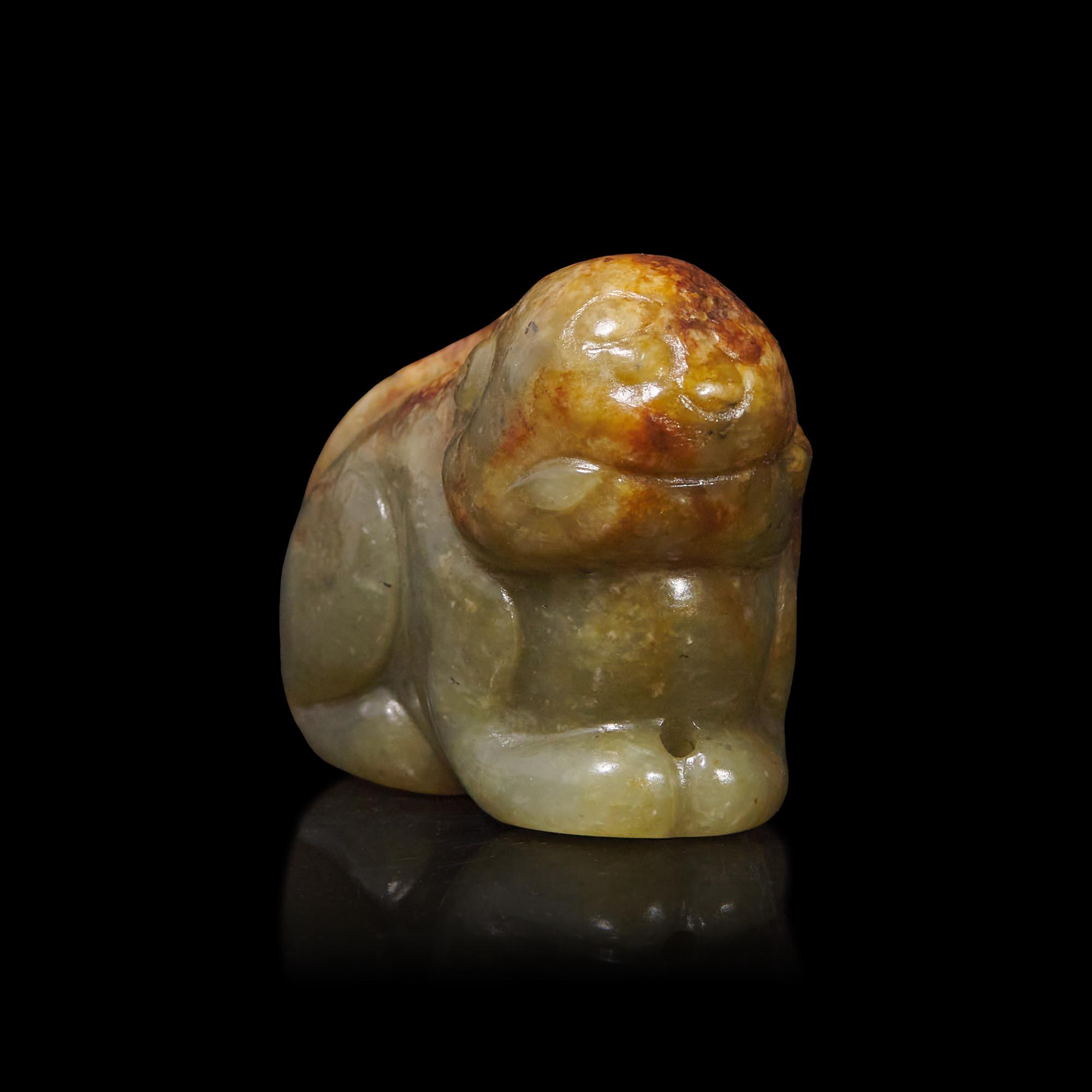 A Small Chinese Brown and Celadon Jade Mythical Beast, Ming Dynasty or Earlier 明或更早 青玉瑞獸