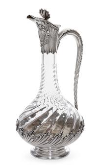 A French Silver Mounted Glass Claret Jug, 19th/20th Century, of baluster form, the glass with twist decoration, the silver with rocaill