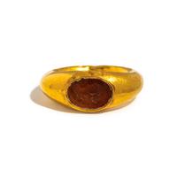 A Roman Gold and Carnelian Finger Ring with a Male Portrait Head