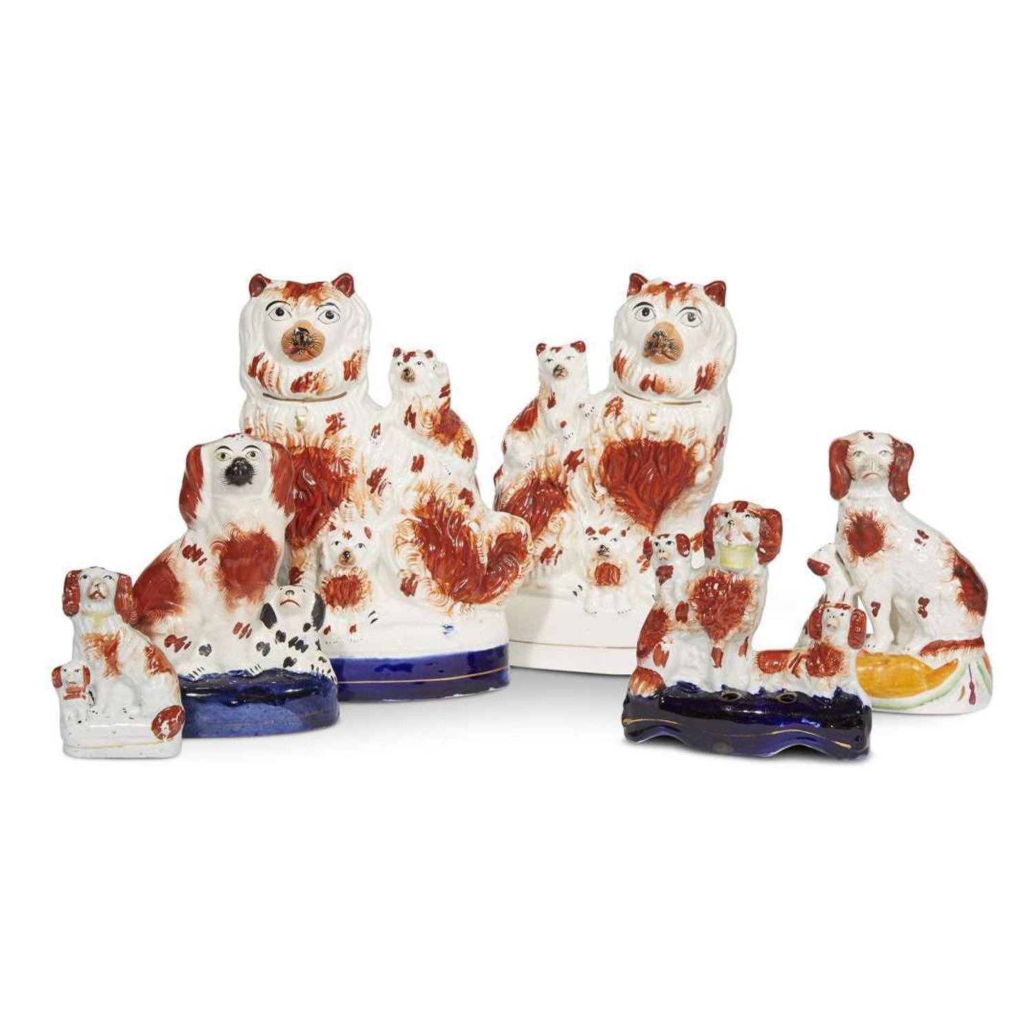 A large collection of seated Staffordshire dog figures 19th/20th centuries