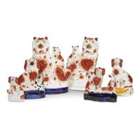 A large collection of seated Staffordshire dog figures 19th/20th centuries